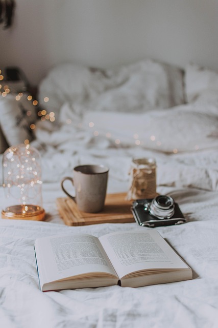Person enjoying a quiet moment with a book in a cozy, styled corner, showcasing mindful living.
